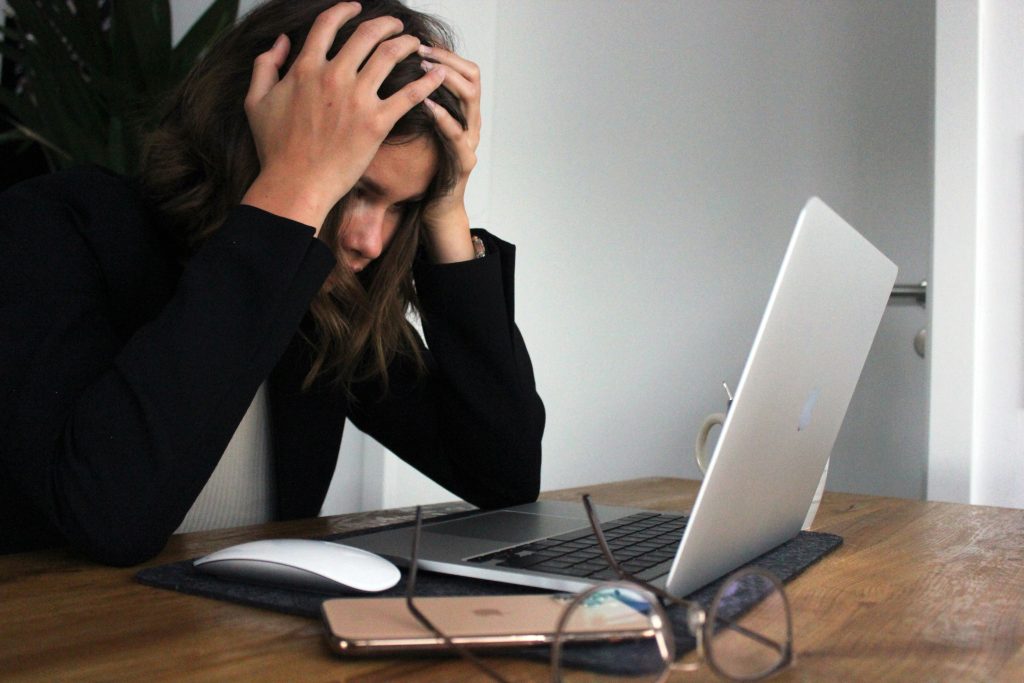 Woman with burnout in front of computer