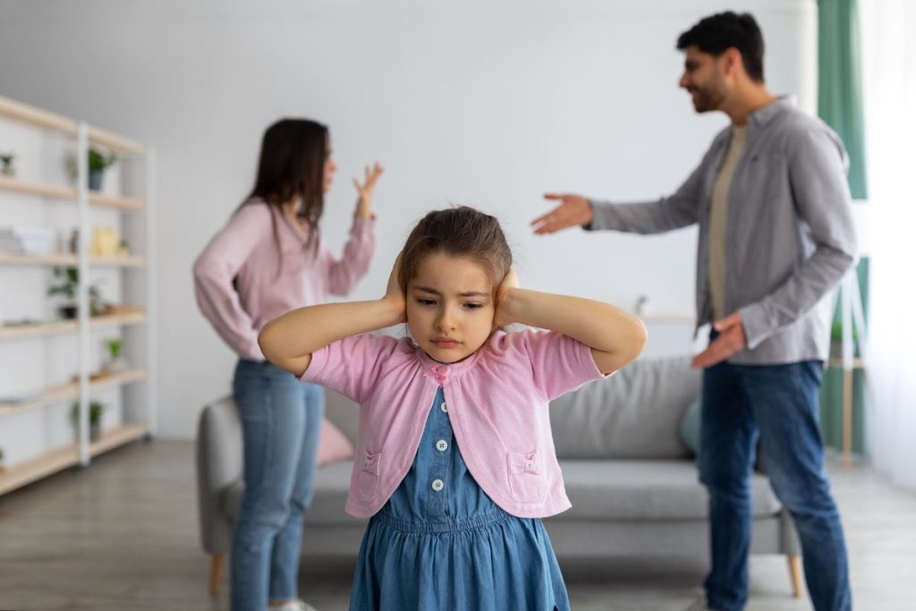 Counselling for Intergenerational Trauma. Couple arguing in front of child.
