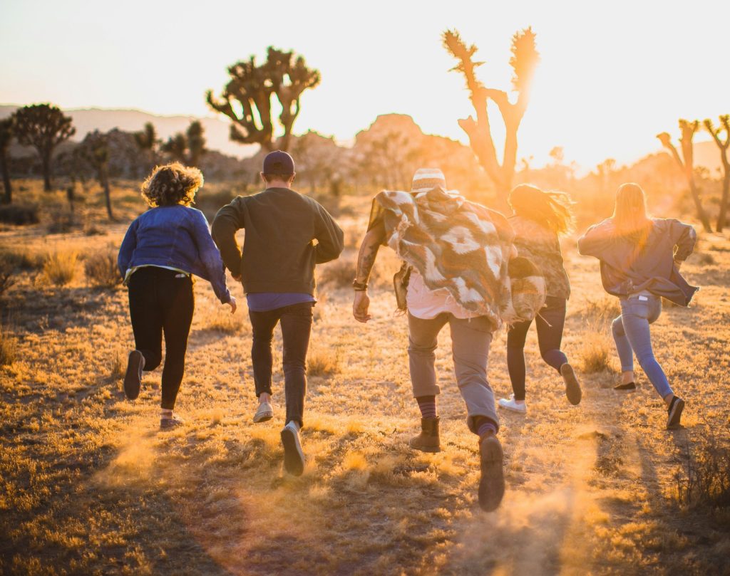 Group of Teenagers Running outside